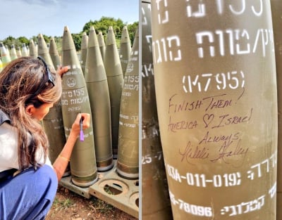 Η Νίκι Χέιλι φωτογραφίζεται καθώς γράφει «αποτελειώστε τους» πάνω σε ισραηλινή οβίδα